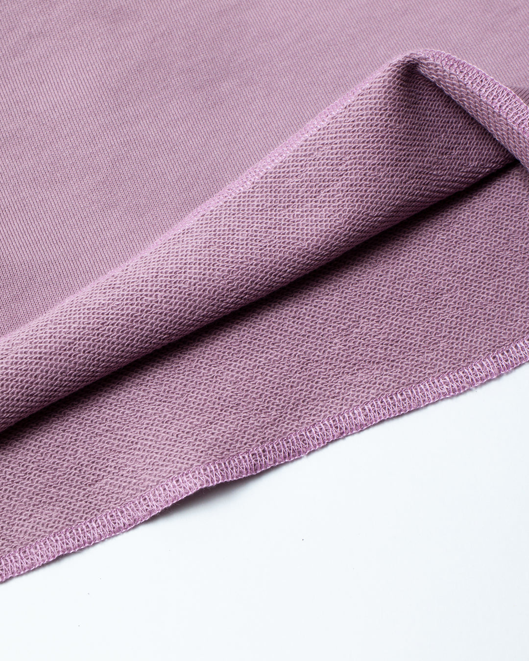 Close up on the inside texture of a flared lavender short.