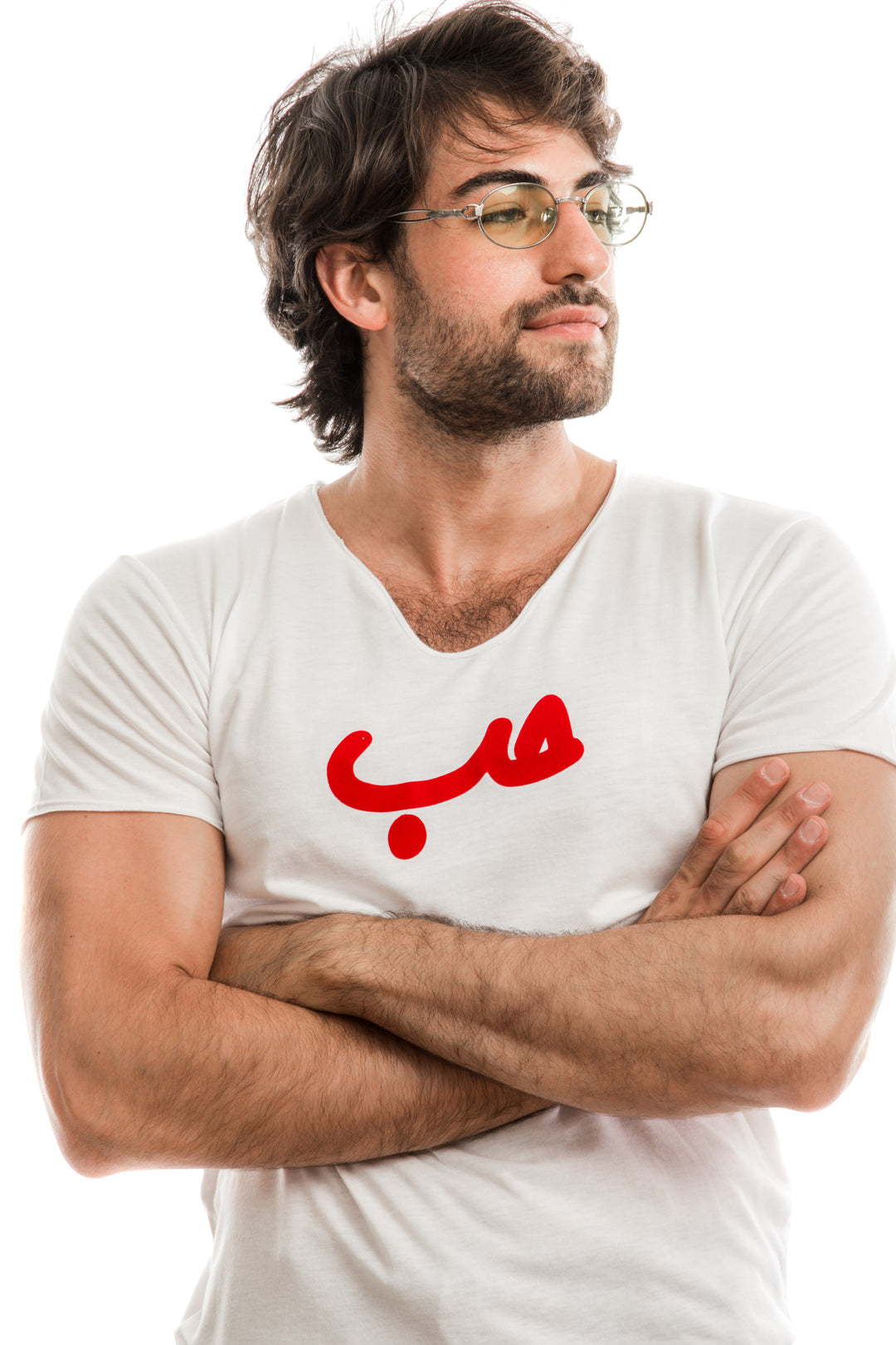 Young adult male wearing white T-shirt with Hobb written in Arabic حب and printed in red velvet in the center of the T-shirt along with glasses.